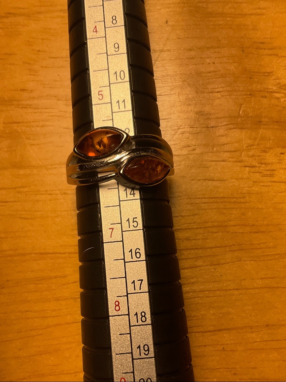 3 gram silver and two amber stone ring size 6 is sizable.